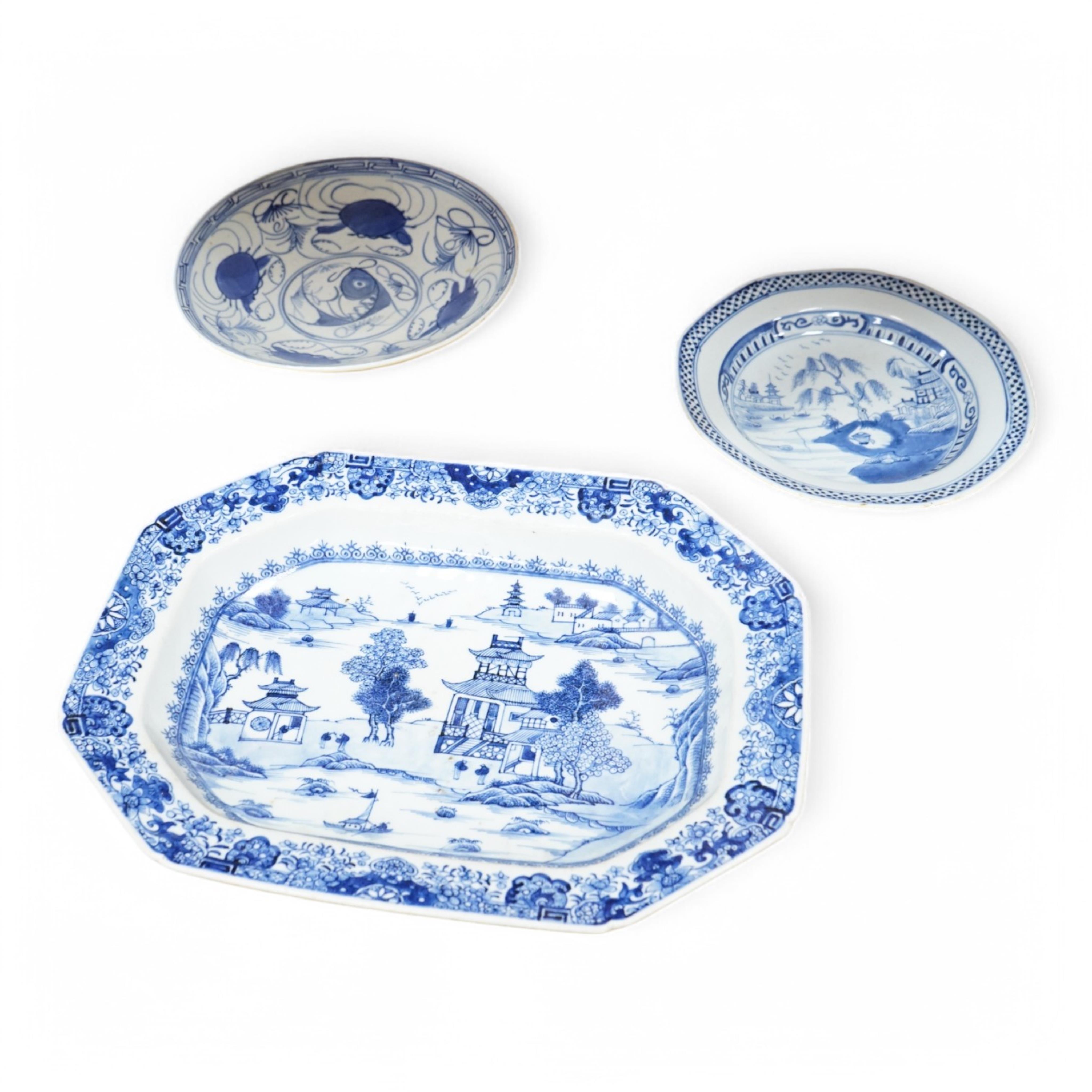 A 18th century Chinese export blue and white octagonal serving dish and two blue and white dishes, largest 38cm wide. Condition - one plate cracked